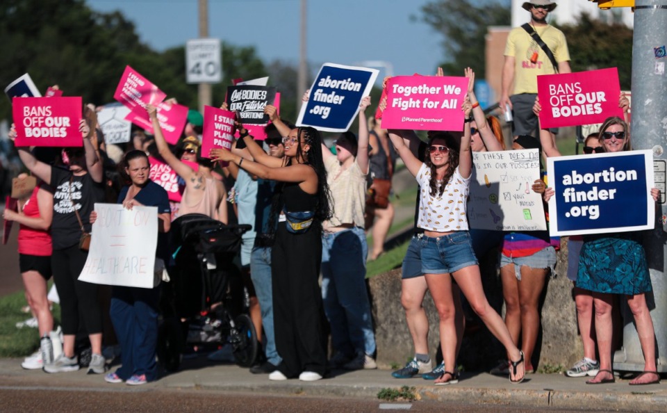 <strong>Protesters cheered at the honks coming from cars at the intersection of Poplar Avenue and McLean Boulevard after the Supreme Court overturned Roe v. Wade June 24, 2022.</strong> (Patrick Lantrip/Daily Memphian)
