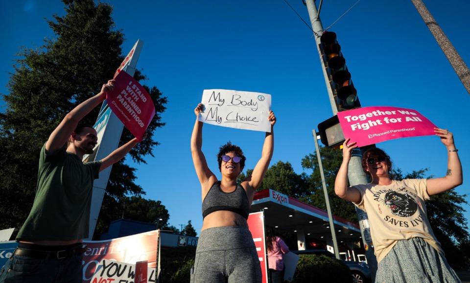 <strong>Rachel Maxann stands at the intersection of Poplar Avenue and McLean Boulevard on June 24, 2022.</strong> (Patrick Lantrip/Daily Memphian)