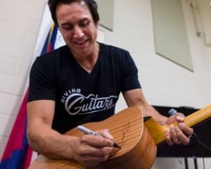 <strong>Country musician Steven Cade presented a signed guitar to Salvation Army's Purdue Center of Hope on Saturday June 25, 2022.</strong> (Ziggy Mack/The Dailly Memphian)