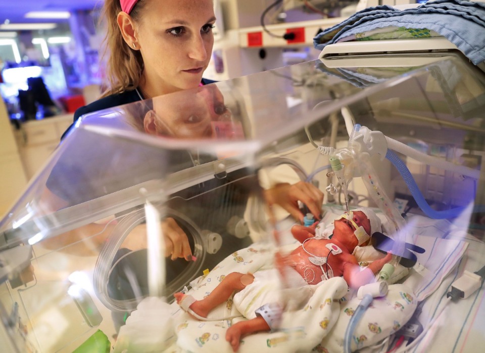 <strong>A nurse clears the lungs of a premature newborn at Regional One Health's NICU (neonatal intensive care unit).&nbsp;Before the current county commission&rsquo;s term ends, they hope to find $350 million in capital funding for the county-owned hospital.</strong> (Jim Weber/The Daily Memphian file)