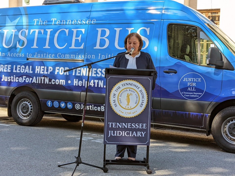 <strong>Davidson County General Sessions Judge Ana Escobar speaks at the dedication of the Justice Bus in Nashville. The Tennessee Supreme Court launched the free legal clinic on wheels. It has Wi-Fi,&nbsp;laptops, a printer, and a scanner for Tennesseans who need help with legal matters.</strong> (Julia Ritchey/WPLN-FM via AP)