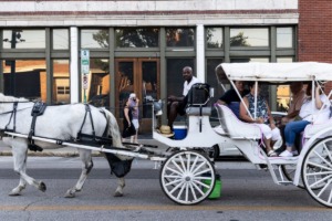 <strong>On a warm evening, a carriage ride offers an alternative to walking along South Main.</strong> (Brad Vest/Special to The Daily Memphian)