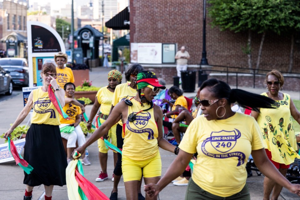 <strong>Adrienne Roddy, center, and other dancers from Line-Tastic Link of Memphis perform along South Main Street during the South Main Trolley Night.</strong> (Brad Vest/Special to The Daily Memphian)