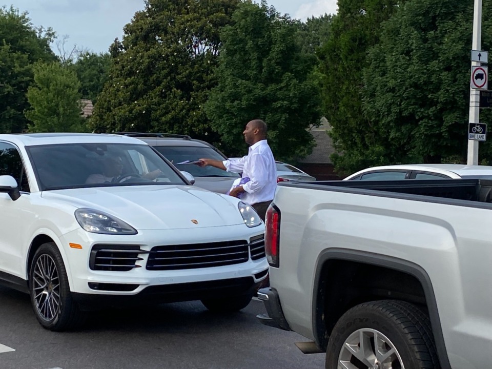 <strong>Shelby County Mayor Lee Harris looks for votes at Poplar and Highland during the afternoon rush hour.</strong> (Bill Dries/Daily Memphian)