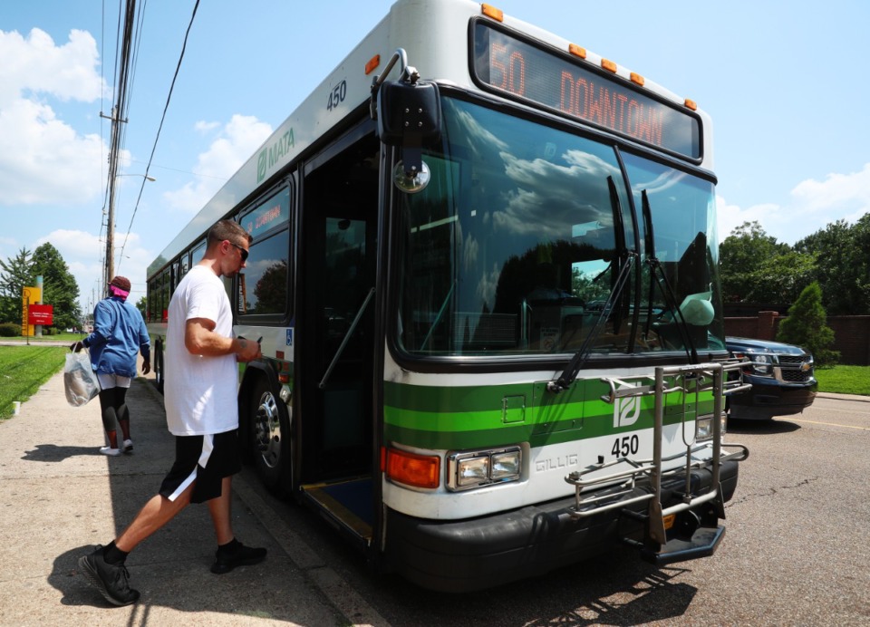 <strong>A passenger boards the MATA 50 heading Downtown from the Benjamin L. Hooks library. The County Commission and City Council have both approved ongoing revenue streams for the city agency.</strong> (The Daily Memphian file)