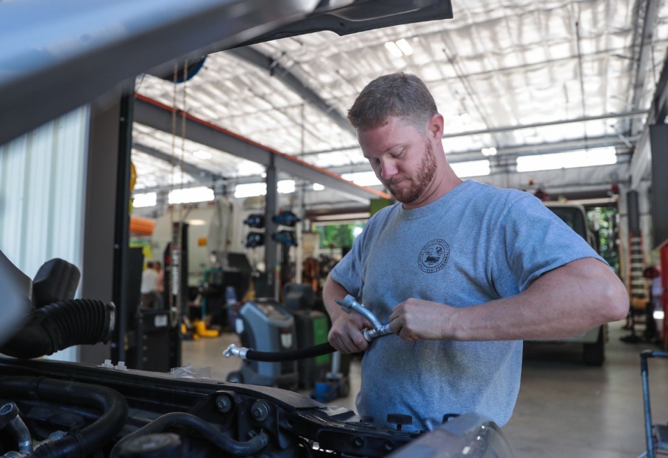 <strong>Robert Parker works on a police car at Bartlett's new A. Keith McDonald Fleet Maintenance Facility. The city unveiled the new facility on Tuesday, June 28.</strong> (Patrick Lantrip/Daily Memphian)