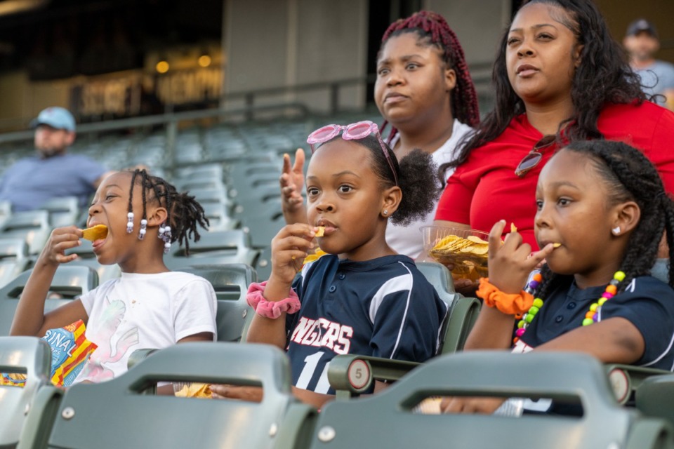 <strong>Mariah Curry, 8, Camile Johnson, 6, and Paris Brown, 6, enjoy free nachos during the Redbirds&rsquo; Nacho Average Tuesday at AutoZone Park on June 28. On Tuesdays, fans receive a free order of nachos with the purchase of a ticket.</strong> (Greg Campbell/Special to The Daily Memphian)