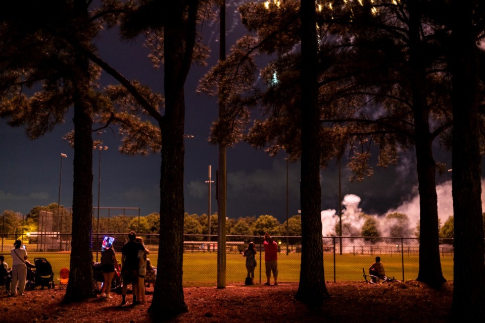 <strong>Residents watch the fireworks show during Collierville&rsquo;s annual Independence Day celebration on Saturday at H. W. Cox Park.</strong> (Brad Vest/Special to The Daily Memphian)