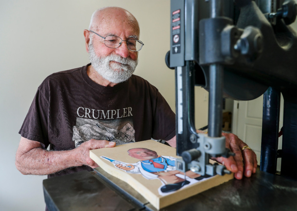 <strong>Ed Crumpler uses a bandsaw to cut his playful wooden caricatures.&nbsp;&ldquo;It will let you make corners better,&rdquo; he said of his tool choice.</strong> (Mark Weber/The Daily Memphian)