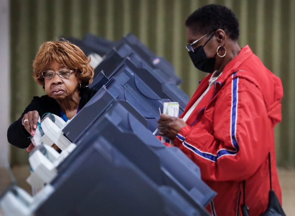 <strong>A precinct volunteer helps a voters cast their ballot during early voting on Wednesday, April 20, 2022 at Abundant Grace Fellowship Church.</strong> (Mark Weber/The Daily Memphian)