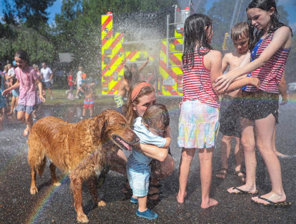 <strong>Kids and pets play in the water at the 73rd annual High Point Terrace Fourth of July parade July 4, 2022.</strong> (Patrick Lantrip/Daily Memphian)