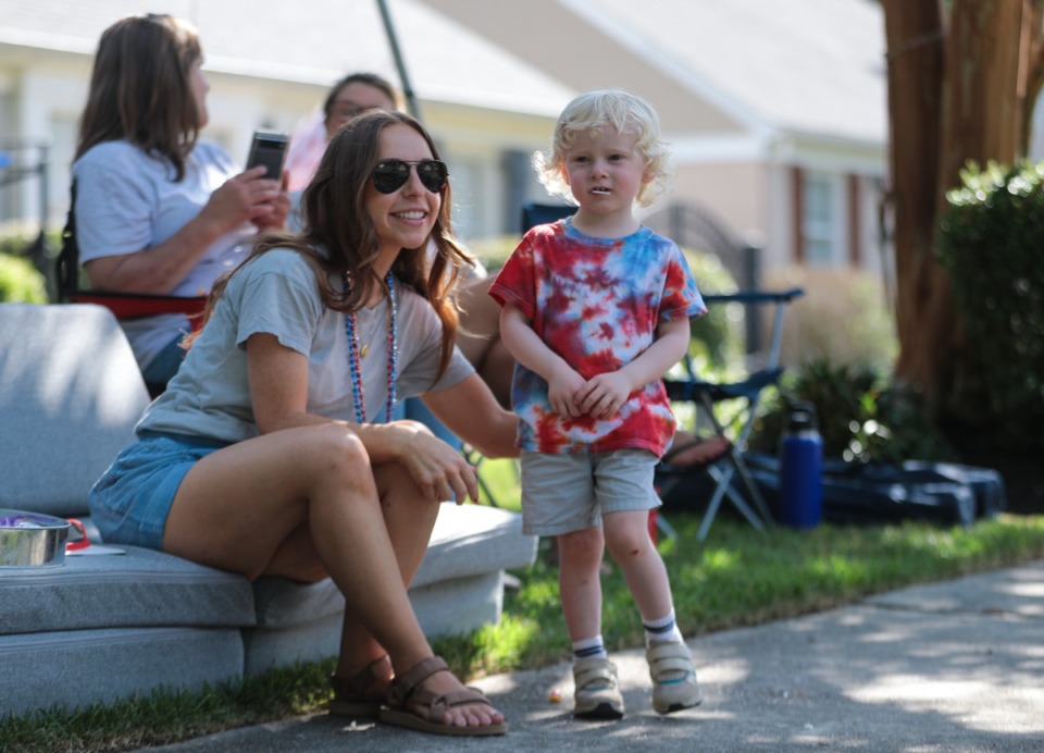 <strong>Family in the neighborhood watch the at the 73rd annual High Point Terrace Fourth of July parade from their porches July 4, 2022.</strong> (Patrick Lantrip/Daily Memphian)