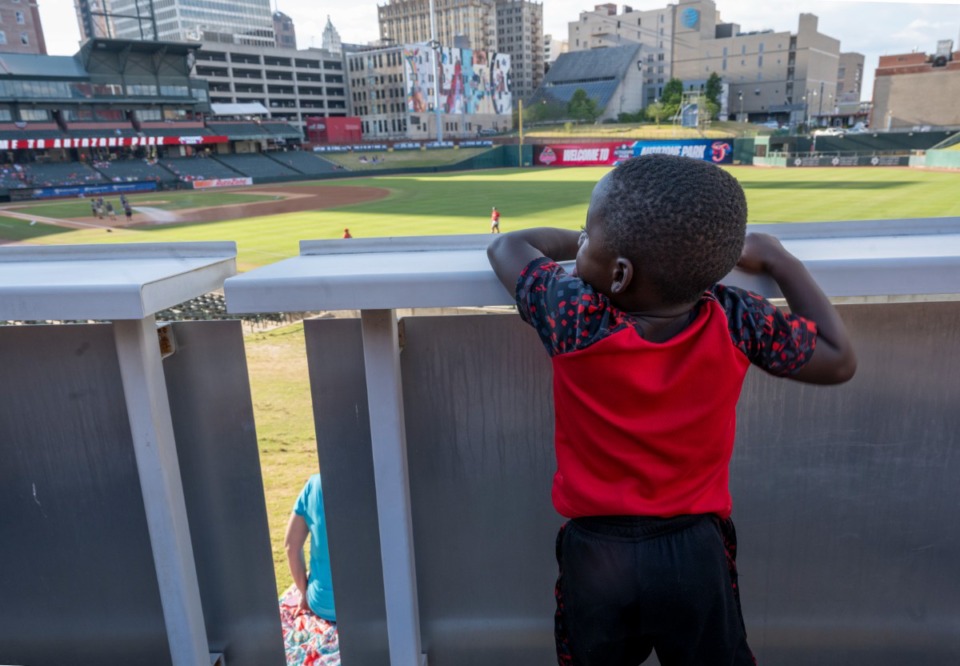 <strong>Camden Braxton, 2, tries to get a better look at the Redbirds game during the AutoZone Park Fourth of July celebration at AutoZone Park, Friday, July 1, 2022.</strong> (Greg Campbell/Special for The Daily Memphian)
