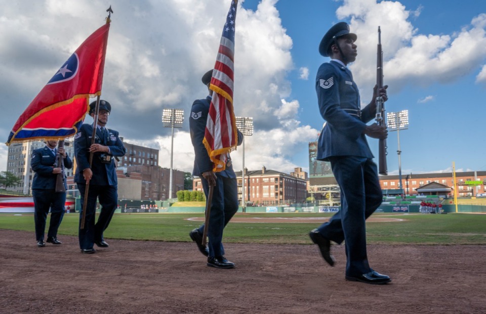 <strong>The honor guard carries flags as part of their presentation for the AutoZone Fourth of July celebration Friday, July 1, 2022.</strong> (Greg Campbell/Special for The Daily Memphian)