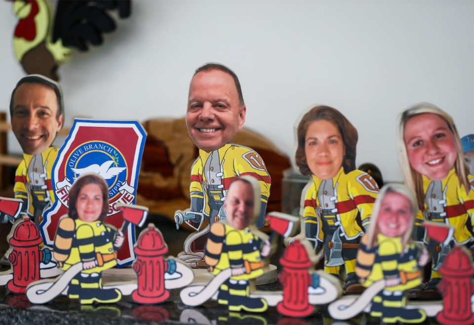 <strong>Among Ed Crumpler&rsquo;s wooden caricatures are figures of Olive Branch firefighters.</strong> (Mark Weber/The Daily Memphian)