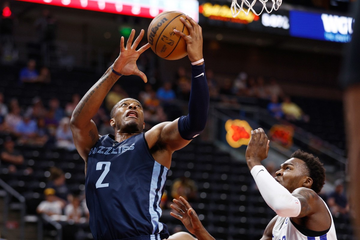 <strong>Memphis Grizzlies center Xavier Tillman Sr. (2) shoots against Philadelphia 76ers forward Paul Reed Jr. on Tuesday, July 5, in Salt Lake City.</strong> (Jeff Swinger/AP)