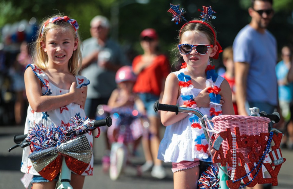 <strong>People say the pledge of allegiance before the 73rd annual High Point Terrace Fourth of July parade July 4, 2022.</strong> (Patrick Lantrip/Daily Memphian)