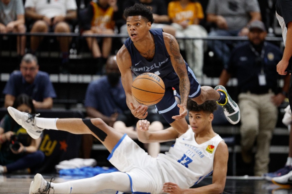 <strong>Memphis Grizzlies guard Ronaldo Segu, top, gets off a pass against Oklahoma City Thunder forward Ousmane Dieng (13) on July 6 in Salt Lake City.</strong> (Jeff Swinger/AP)