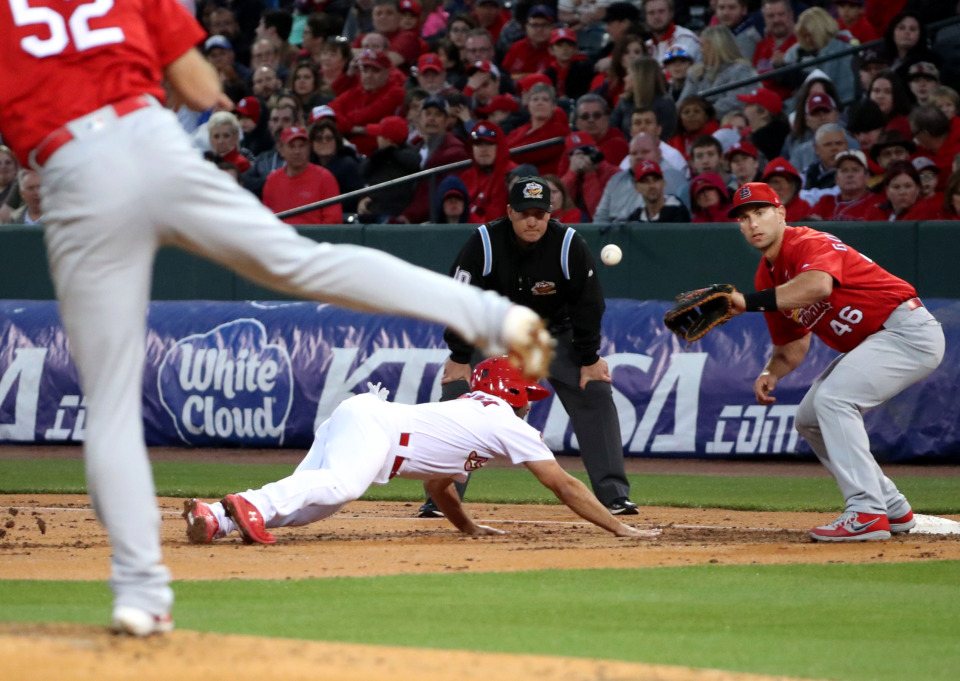 <strong>A St. Louis Cardinals pitcher slings the ball toward first baseman Paul Goldschmidt (46) to try and get a Memphis Redbirds runner out during the Battle of the Birds game on Monday, March 25, at AutoZone Park.</strong> <strong>Goldschmidt was acquired during an offseason trade with Arizona and then signed to a five-year, $130 million extension this spring.</strong> (Houston Cofield/Daily Memphian)
