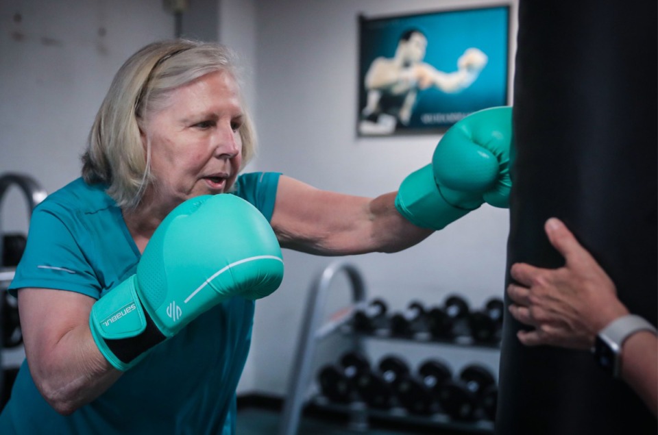 <strong>Judy Jenkins works the heavy bag at the Memphis Police boxing gym.</strong> (Patrick Lantrip/Daily Memphian)