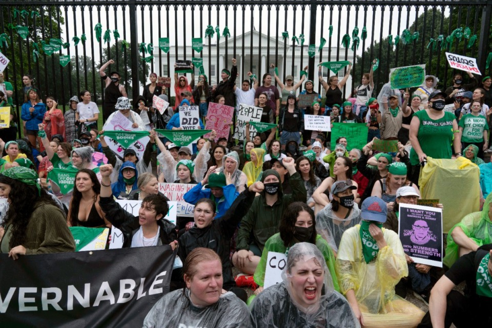 <strong>Abortion-rights demonstrators shout slogans after tying green flags to the fence of the White House during a protest to pressure the Biden Administration to protect abortion rights, in Washington, Saturday, July 9, 2022.</strong> (Jose Luis Magana/AP)