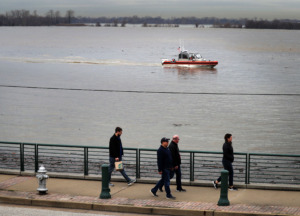 <strong>A Coast Guard patrol passes close to Beale Street landing on Feb, 27, 2019.&nbsp;The river at Memphis was at 34.6 feet on the river gauge at 11 a.m. March 28,</strong>&nbsp;<strong>and&nbsp;is expected to go below flood stage sometime Friday.</strong> (Jim Weber/Daily Memphian file)