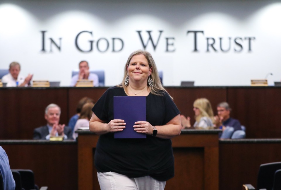<strong>Newly appointed interim Bartlett alderwoman Mandy Young walks back to her seat after getting sworn in at a Bartlett town meeting July 12, 2022.</strong> (Patrick Lantrip/Daily Memphian)