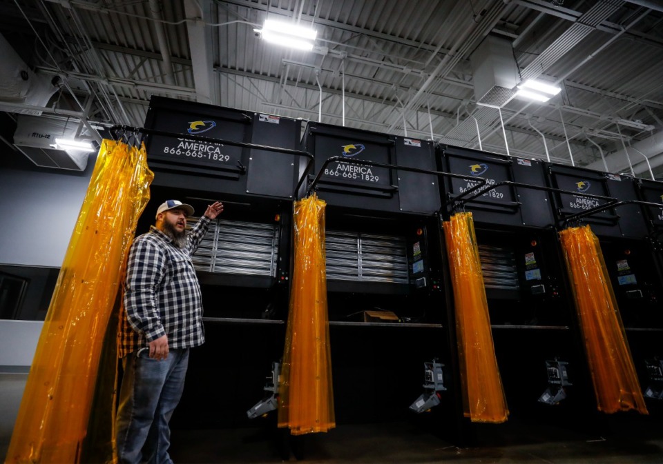 <strong>Tennessee College of Applied Technology welding instructor Chris Leggett explains the new individual welding booths.</strong> (Mark Weber/The Daily Memphian file)