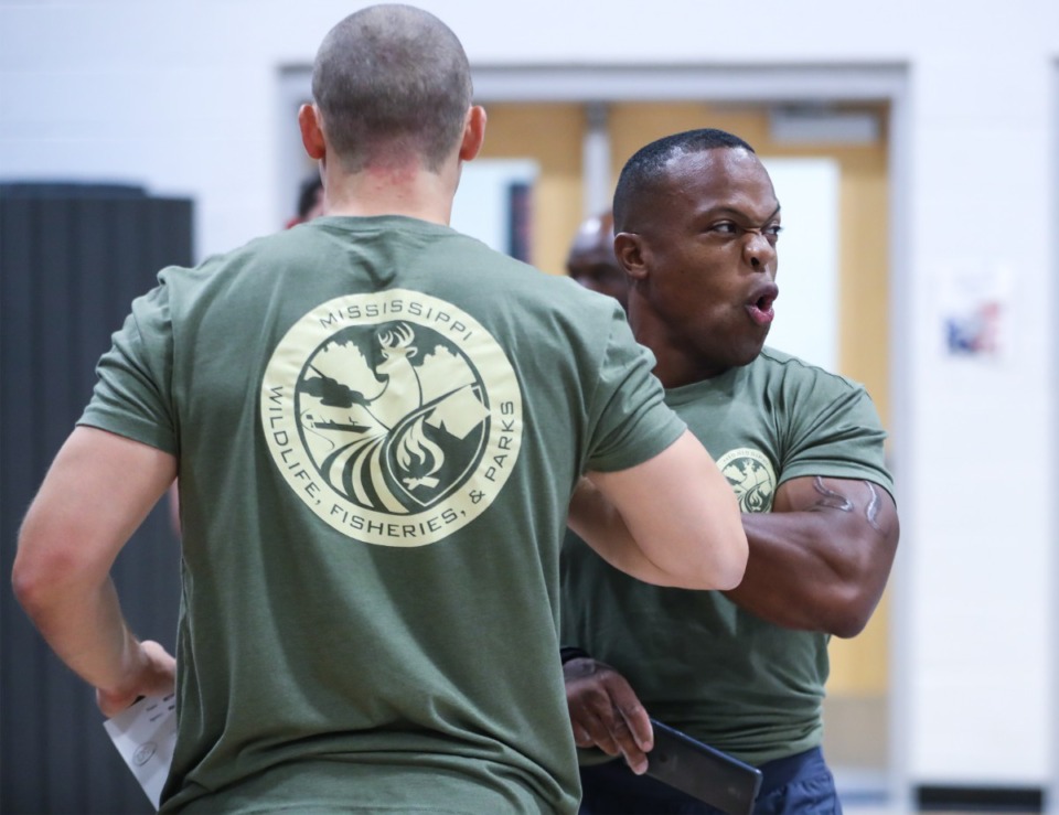 <strong>Derrick Scott with the Mississippi Department of Wildlife, Fisheries and Parks celebrates his coworker&rsquo;s&nbsp;lift at the 20th annual National LawFit Challenge July 14, 2022.</strong> (Patrick Lantrip/The Daily Memphian)