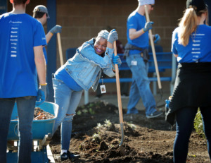 <strong>Andrea Williams takes a break from landscaping as ServiceMaster employees help out at Kirby High School on Thursday, March 28, during Spring Clean '19, a citywide beautification project to help local schools tidy up their properties.</strong>&nbsp;<strong>ServiceMaster deployed an estimated 350 employees to the SCS campuses for landscaping, painting and other cleanup efforts. Volunteers also went to Ida B. Wells Academy, Booker T. Washington High School and Riverview Middle School.</strong> (Jim Weber/Daily Memphian)