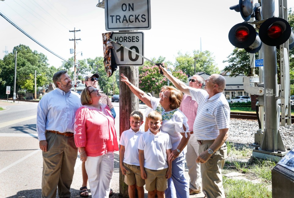 <strong>The Ueleke family unveils a new horse speed limit sign in Germantown on Thursday, July 21, 2022 on West Street in Germantown.</strong> (Mark Weber/The Daily Memphian)