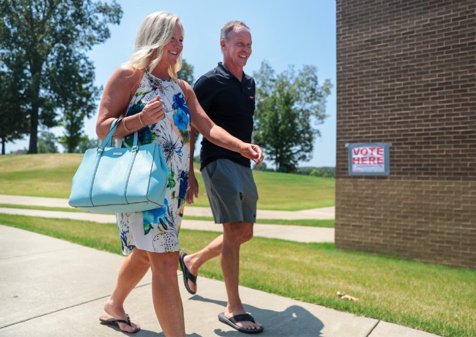 <strong>Michael and Courtney Barnes walk out of an early voting location in Arlington on July 22, 2022.</strong> (Patrick Lantrip/Daily Memphian file)