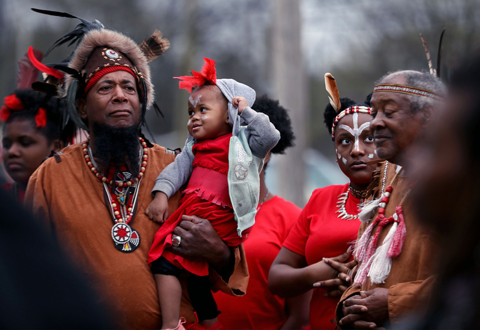 <strong>Chief Andre Mathews (left), along with Abria Franklin and Willie Franklin of the Oka Nashoba Chickasaw Nation, joined a rally in New Chicago against the Memphis 3.0 plan while holding young Savanna Franklin on Saturday, March 30, 2019.</strong> (Patrick Lantrip/Daily Memphian)