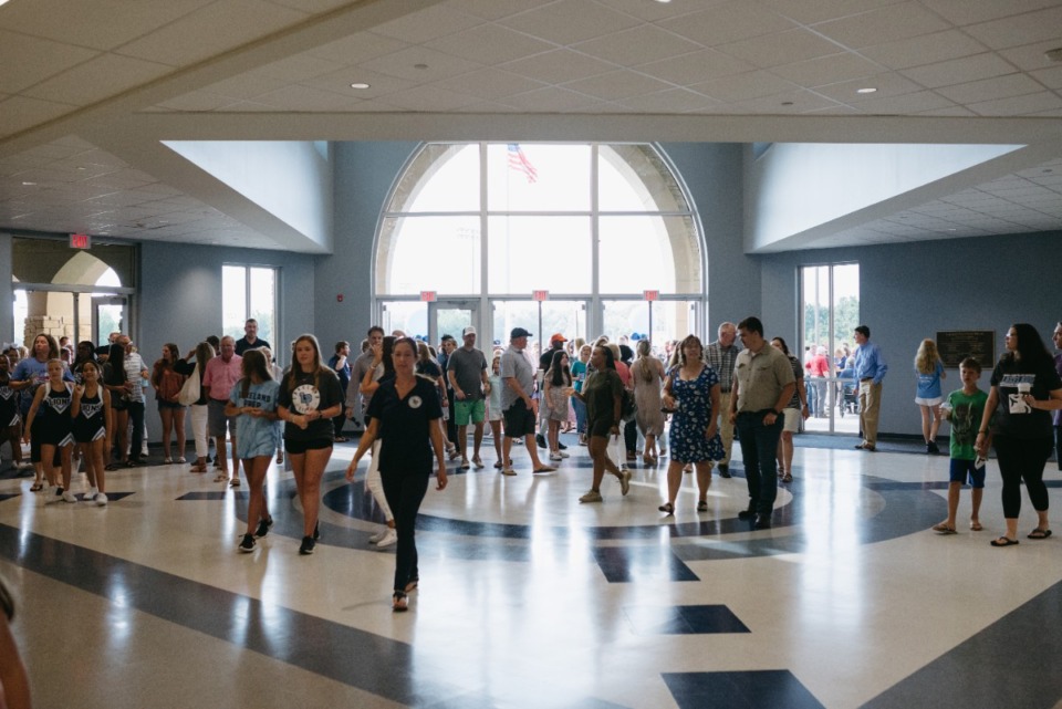 <strong>Excited attendees flood through the doors to explore the new Lakeland Preparatory School, Saturday July 30, 2022.</strong> (Lucy Garrett/Special to The Daily Memphian)