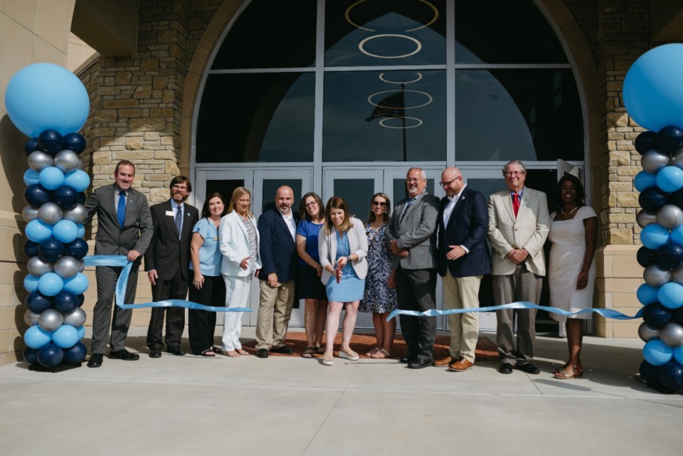<strong>Elected officials from the Lakeland board of commissioners and the Lakeland board of education cut the ribbon to the new Lakeland Preparatory High School, Saturday July 30, 2022.</strong> (Lucy Garrett/Special to The Daily Memphian)