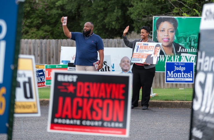 <strong>Workers hold campaign signs outside Anointed Temple of Praise. Now that early voting has ended, candidates are gearing up for Aug. 4.</strong> (Patrick Lantrip/Daily Memphian)