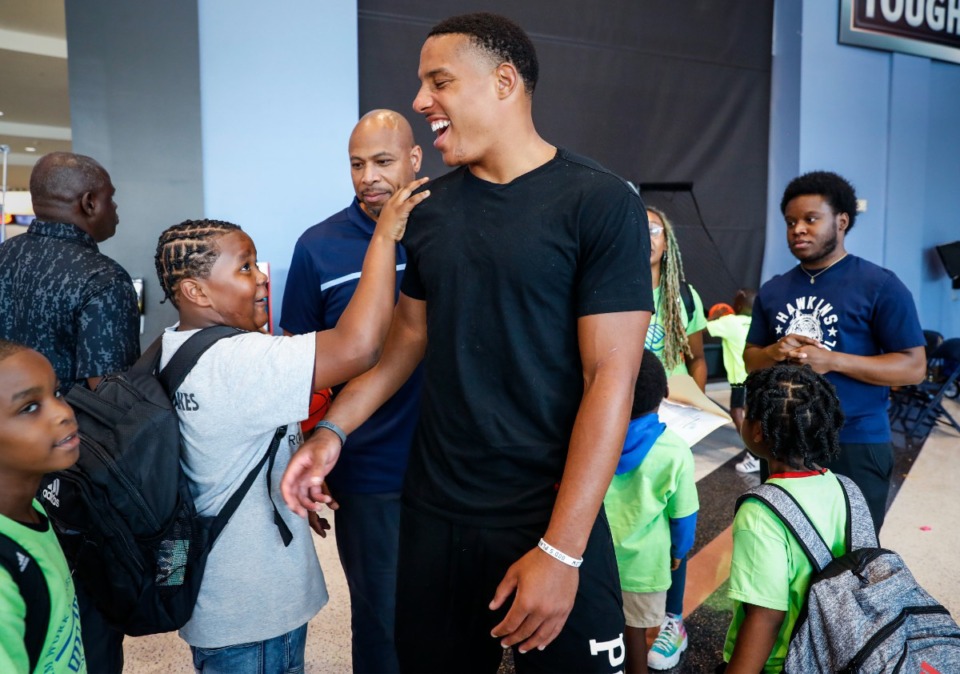 <strong>Memphis Grizzlies guard Desmond Bane (middle) jokes with children from the Boys and Girls Clubs of Greater Memphis during a back-to-school event on Monday, Aug. 1.</strong> (Mark Weber/The Daily Memphian)