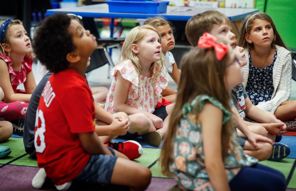 <strong>Collierville Elementary School first-graders listen as their teacher reads &ldquo;First Day Jitters&rdquo; by&nbsp;Julie Danneberg, on the first day of school on Monday, Aug. 8.&nbsp;&ldquo;It&rsquo;s my very favorite day of the year,&rdquo; teacher Lindsey Luzar said.</strong> (Mark Weber/The Daily Memphian)