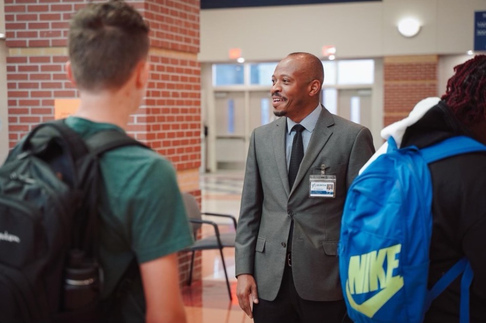 <strong>Arlington High School Principal Shannon Abraham greets students on first day of classes. </strong>(Courtesy Arlington Community Schools)