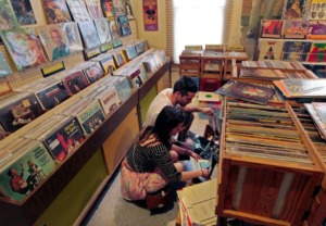 <strong>Two music fans searched for posters at Shangri-La Records during the shop&rsquo;s 25th year in business.</strong> (The Daily Memphian file)