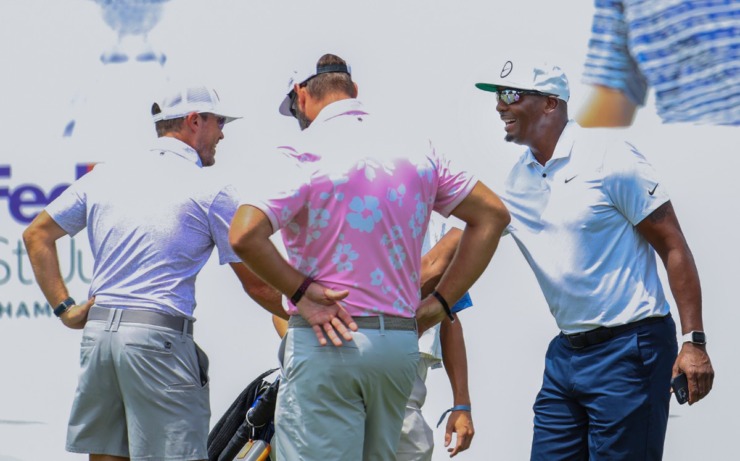 Penny Hardaway (right) shakes hands with other golfers at the putting green of the FedEx St. Jude Championship Pro-Am at TPC Southwind Aug. 10, 2022. (Patrick Lantrip/Daily Memphian)