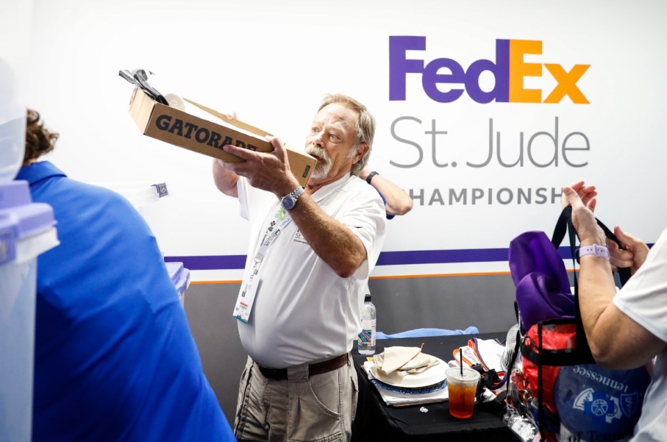 <strong>Tommy Adcock, who works in &ldquo;caddie services,&rdquo; has been volunteering at the golf tourament for 23 years. He&rsquo;ll likely spend 70 hours this week serving at the FedEx St. Jude Championship.</strong> (Mark Weber/The Daily Memphian)