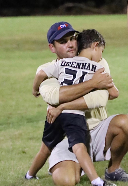 <strong>Will Drennan embraces his son Hayden Drennan.</strong> (Courtesy Matt Young)