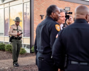 <strong>Officials with the Tennessee Highway Patrol and Memphis Police Department surround Gov. Bill Lee as he announced in March his plan to add state troopers to help officers patrol Shelby County interstates.</strong> (Houston Cofield/Special To The Daily Memphian file)