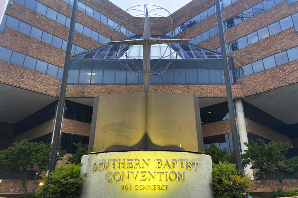 <strong>A cross and Bible sculpture stand outside the Southern Baptist Convention headquarters in Nashville, on May 24, 2022. The Executive Committee of the Southern Baptist Convention said Friday, Aug. 12, 2022, that several of the denomination's major entities are under investigation by the U.S. Department of Justice.</strong> (AP Photo/Holly Meyer, File)