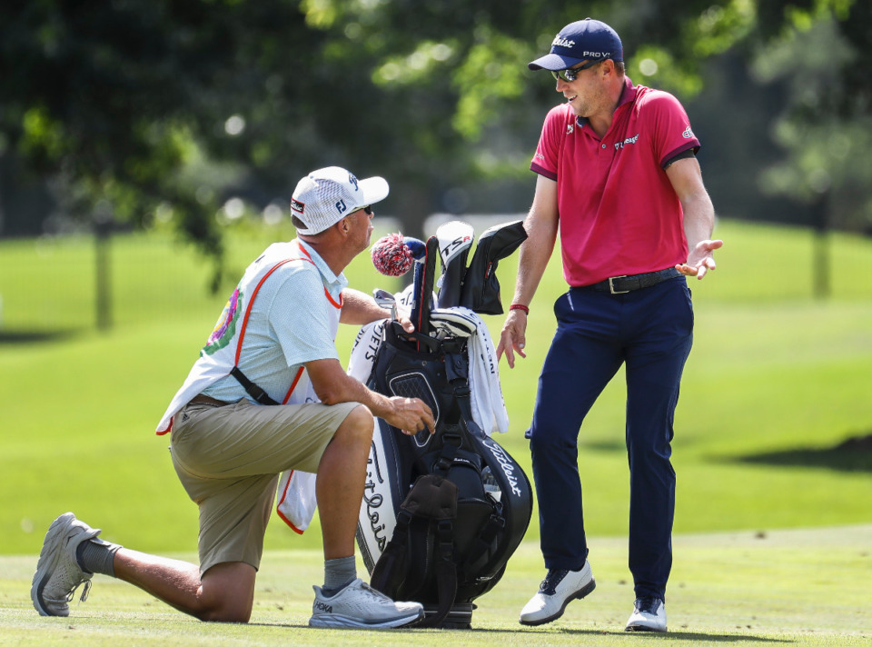 <strong>PGA golfer Justin Thomas (right) jokes with his caddie Jim McKay on the 9th hole fairway during second round action of the FedEx St. Jude Championship on Friday, August 12, 2022.</strong> (Mark Weber/The Daily Memphian)