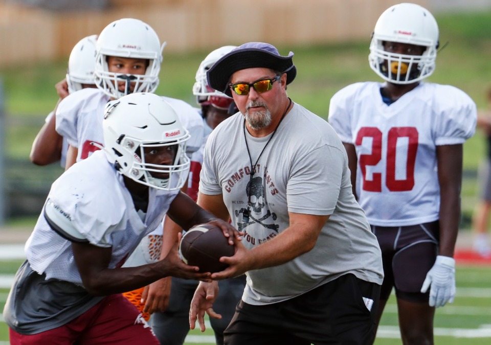 <strong>Assistant Munford coach Tim Driscoll works with his team during practice on Monday, Aug. 8, 2022. </strong>(Mark Weber/The Daily Memphian)