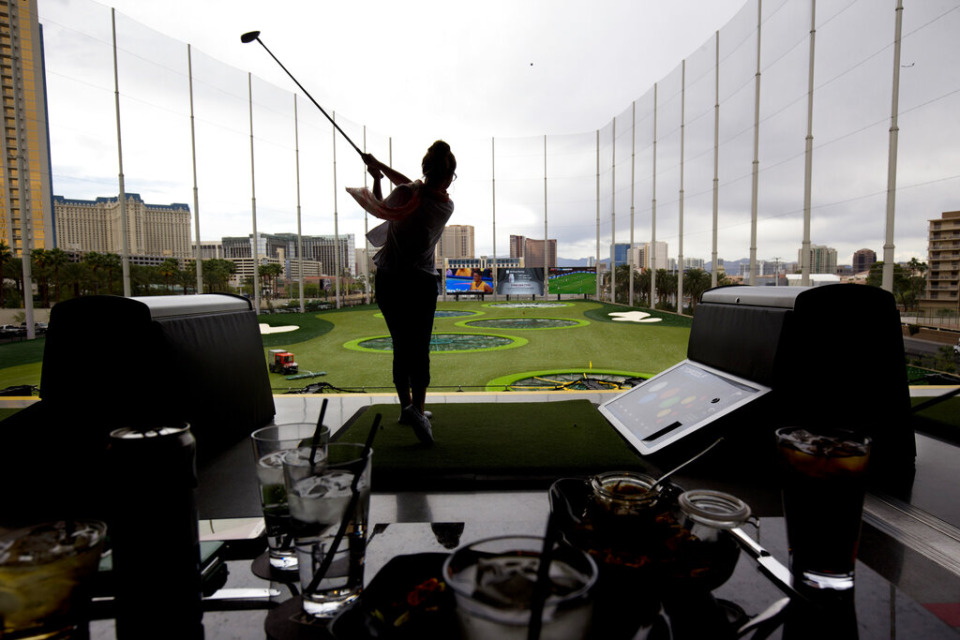 <strong>A golfer makes a shot from the third level of Topgolf Las Vegas.</strong> (Steve Marcus/Las Vegas Sun via AP file)