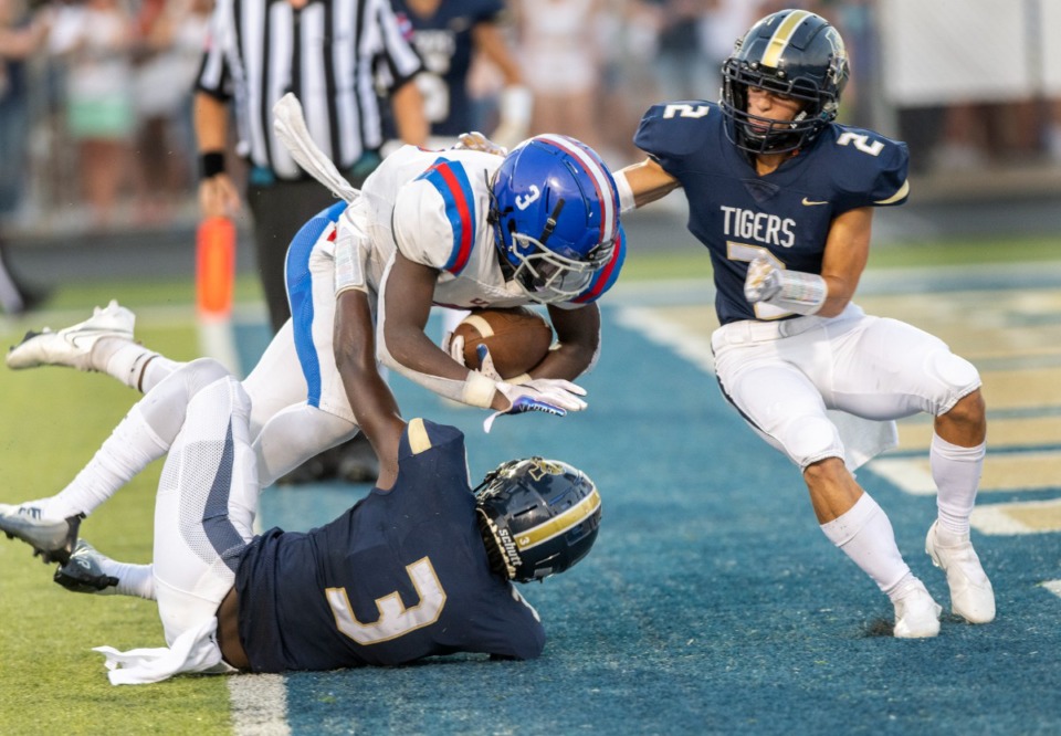 <strong>MUS running back Mikhi Shaw (3) runs over Arlington&rsquo;s Makale McNeil (3) to score in the second quarter on Friday, Aug. 19, 2022.</strong> (Greg Campbell/Special to The Daily Memphian)