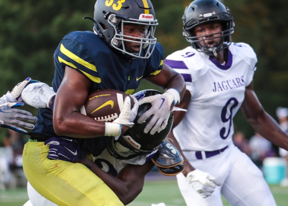 <strong>Lausanne running back Tyler Wilson (33) powers through the Southwind defense on Aug. 19, 2022.</strong> (Patrick Lantrip/Daily Memphian)